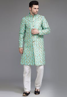 Ready-made Art Silk Sherwani in Turquoise Color. Crafted in Chinese Collar and Full Sleeves, this Ready-made attire with Satin Lining is Enhanced with Buttons, Pockets, Sequins and Zari Work. Available with a Art Silk Pant in White Color.   Do note: Footwear, Stole and Kanthimala shown in the image is for presentation purposes only. Half to one inch may vary in measurement. (Slight variation in actual color vs. image is possible)           We sell all kinds of menswear. Mens Sherwani | Art Silk Green Sherwani With Zari Work Straight Kurta, Green Sherwani With Zari Work, Straight Kurta Style, Green Sherwani With Zari Work, Green Bandhgala With Zari Work For Navratri, Green Sherwani With Resham Embroidery, Anarkali Sherwani With Pallu And Long Sleeves, Green Bandhgala With Resham Embroidery For Festivals, Green Bandhgala For Wedding And Navratri, Green Bandhgala With Zari Work For Eid