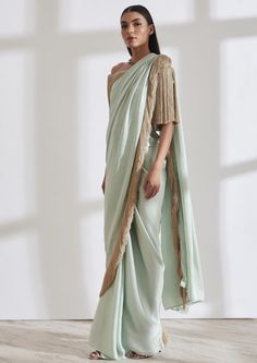 Our noor fringe sari features a full pre-draped sari that looks like a regular sari with our signature fringe detail. Pair it with the off shoulder fringe top or get in touch for more blouse options. Bollywood Blouse Piece With Tassels In Traditional Drape, Bollywood Blouse Piece With Traditional Drape And Tassels, Festive Saree Blouse Piece With Tassels, Bollywood Style Blouse Piece With Tassels, Elegant Party Pre-draped Saree With Tassels, Traditional Drape Blouse Piece With Tassels, Bollywood Style Designer Saree With Tassels, Bollywood Style Saree With Tassels For Reception, Bollywood Designer Saree With Tassels