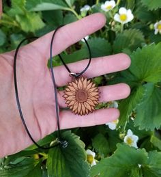 "Sunflower Necklace, wooden necklace, wood burned, customizable necklace, personalized gift ¼\" thick cherry wood necklace on a black waxed cord with a metal clasp. Wood is cut and laser engraved as a sunflower that I drew digitally. Sunflower Size - 1.5\" x 1.5\" Necklace length - 10\" Backside is either blank or you can have a custom text engraved on the backside. I will contact you after purchase to discuss text and font. Ships in 1-3 days Shipped in all eco-friendly packing" Wood Burned Necklace, Natural Waxed Cord Necklace As Gift, Natural Waxed Cord Necklace For Gift, Customizable Necklace, Necklace Wood, Sunflower Pendant, Sunflower Necklace, Wooden Necklace, Wood Necklace