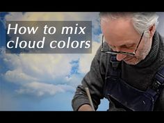 a man writing on a piece of paper with the words how to mix cloud colors