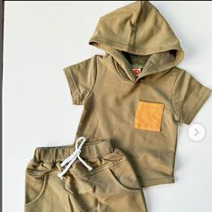 I Have This Set In The Grey Color. 65% Cotton 35% Polyester. Summer Hooded Tops With Pockets, Hooded Summer Top With Pockets, Beige Tops For Playwear In Spring, Beige Tops For Spring Playwear, Short Sleeve Tops With Pockets For Playtime, Casual Beige Tops For Playwear, Cotton Tops With Pockets For Playwear, Casual Tops With Pockets For Playtime, Nike Sweat Suit