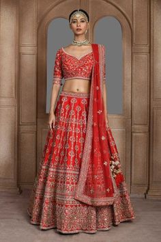 Red raw silk lehenga with attached can-can, all over vintage jaal pattern, threads and zardozi embroidery. Paired with leaf neck padded blouse with all over floral jaal pattern embroidery and dupatta.
Components: 3
Pattern: Embroidered
Type Of Work: Thread and Zardozi Work
Neckline: Leaf Neck
Sleeve Type: Half Sleeves
Fabric: Raw Silk
Color: Red
Other Details: 
Deep U back
Lehenga Length Approx (in inch): 45 - 46
Closure:
Lehenga: Side tasselled tie-up
Blouse: Back tasselled tie-up
Occasion: Bri Grey Lehenga, Kurta Lehenga, Lehenga Pattern, Raw Silk Lehenga, Zardozi Work, Zardozi Embroidery, Anamika Khanna, Diana Penty, Padded Blouse