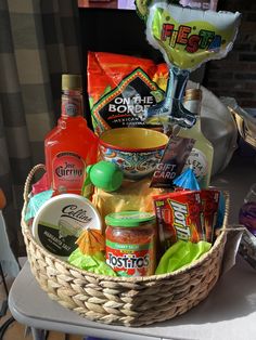 a basket filled with condiments sitting on top of a table