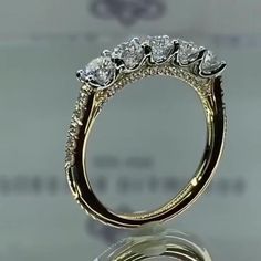 a diamond ring is shown with three diamonds on it