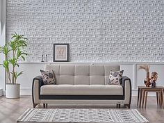 a living room with white brick walls and black trim on the couches, rugs and side tables