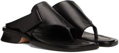 Buffed leather slip-on sandals in black. · Open square toe · Thong-style strap at vamp · Adjustable velcro strap at vamp · Logo embossed at buffed leather footbed · Stacked leather heel · Leather sole · Heel: H1 in Supplier color: Black Luxury Modern T-strap Sandals With Leather Sole, Black Slip-on Flip Flops With Leather Sole, Black Leather Sole Slip-on Sandals, Black Slip-on Mules With Stitched Sole, Black Buckle Closure Slip-on Sandals, Maryam Nassir Zadeh, Velcro Straps, Leather Slip Ons, Flat Sandals