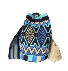 Handmade, exotic and stylish! The stunning, one-of-a-kind Wayuu bag is 100% handmade and carefully crocheted by Wayuu artisans in the desert area of La Guajira in northern Colombia. This unique bag from our Limited Edition is tightly woven by hand using the most traditional single thread technique, making the bag the highest quality, keeping its shape perfectly and being our most sophisticated piece of the entire collection, taking approximately 25 days to weave. This is a very rare item. The be Artisan Blue Tote Bag, Handmade Blue Pouch Shoulder Bag, Artisan Blue Pouch Bag, Blue Tote Shoulder Bag For Festivals, Blue Rectangular Bags For Festival, Artistic Blue Bag For Everyday Use, Artisan Blue Bag For Gift, Artisan Blue Rectangular Bag, Bohemian Blue Bucket Bag With Adjustable Strap