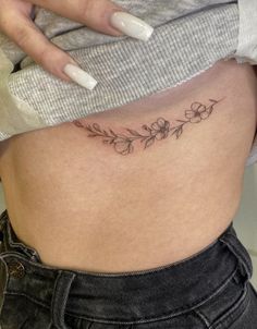 a woman's stomach with flowers on it