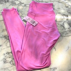 Brand Nwt Butter Soft Leggings With Pockets! Tag Says Purple But I Would Say More Of A Pink Color. Mid To High Rise Lavender Stretch Leggings For Yoga, Lavender Stretch Activewear For Loungewear, Lavender Stretch Leggings For Athleisure, Spring Purple Workout Leggings, Spring Workout Leggings In Purple, Purple Tight Gym Pants, Tight Purple Gym Pants, Lavender Stretch Bottoms For Loungewear, Pink Fitted Tights For Loungewear