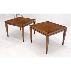 two wooden tables sitting on top of each other