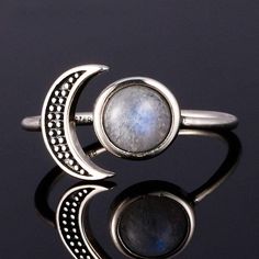 About: This beautiful bohemian 925 Sterling Silver Moon ring is handmade with a natural Moonstone semi-precious gemstone. This ring is adjustable (can fit US sizes 5 to 10). A stone for new beginnings, Moonstone is a stone of inner growth and strength. It soothes emotional instability and stress, and stabilizes the emo Silver Moon Ring, Moon Ring, Rainbow Moonstone Ring, Moonstone Jewelry, Silver Moon, 925 Silver Jewelry, Moonstone Ring, 925 Silver Rings, Free Spirit