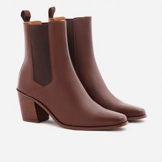 A unique Chelsea boot. Inspired by cowboy boots and western styling, the Bianca Chelsea Boots kick things up a few notches. The semi square toe box, alluring Cuban heel and sculptural shape create a captivating silhouette that will attract the right kind of attention. With a contemporary look and feel, the Biancas love to have fun, and play well with your casual outfits and dressy ensembles. Go ahead, take them for a whirl. This product is made from Gold Rated full-grain calfskin leather sourced Oxford Boots, Cuban Heels, Chelsea Boots Women, Black Boots Women, Chelsea Boot, Black 7, Sneaker Shopping, Boot Shop, Shoe Shop