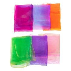 four different colors of tissue paper on a white background