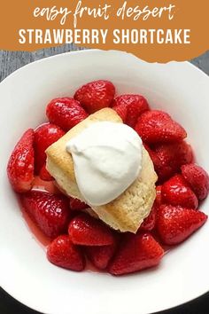 strawberry shortcake with whipped cream in a white bowl on top of a wooden table