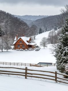 a house in the middle of a snowy field