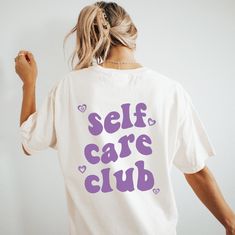 Self Care Club Shirt ★ T-SHIRT DETAILS ★ Soft fabric that is lightweight and flexible. Bella Canvas 3001 tees are slightly longer than your normal tee * 100% cotton * Classic fit - runs true to size * Tear-away label * Made to order * Digitally printed design (DTG)   Slight color variations may occur due to the dyeing process Order a size or two up for an oversized tee fit Shop exclusive designs made by She's Gold Co. Lifestyle brand that aspires to empower and inspire women. Graphic apparel and Self Care Tshirt, Crew Neck T-shirt With Letter Print For Loungewear, Short Sleeve T-shirt With Letter Print For Loungewear, Comfortable Fit Graphic Tee With Short Sleeves, Comfortable Fit T-shirt For Loungewear In Spring, Pre-shrunk Cotton Tops For Loungewear, Comfortable Slogan Top With Short Sleeves, Comfortable Short Sleeve Slogan Top, Short Sleeve Slogan Top