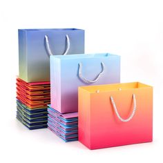 PRICES MAY VARY. 【Reasonable Combination】8.6"x 4"x 7" 30pcs(10Pcsx Blue&Pink+ 10Pcsx Yellow&Orange+ 10Pcsx Blue&Yellow). Kindly to suggest you refer to the 2nd picture for the size details and choose the appropriate bags. 【Beautiful Gradient Color】Blue and pink gradient color enables the bags with a sense of luxury as well as fashion,which could easily attract people's attentions. 【Sturdy Cloth Handles】Newly attached cotton handles is stronger than normal paper handle, and also provides you a mo Retail Shopping Bags, Luxury Packaging Design, Party Favors Birthday, Retail Bags, Favors Birthday, Business Party, Kraft Bag, Merchandise Bags, Wrapping Paper Design