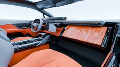 the interior of a car with orange leather seats