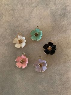 "5 gold tone and mixed colors flower charms, flower charms, flower charm set, flower pendants, black flower charm, green flower charm, pink flower charm, flowers 1 black, 1 pink, 1 purple, 1 seafoam green, 1 white.    ★ Charm Size: 7/8\" L X 3/4\" W.           ★ More charms, beads, pendants, jewelry making supplies and buttons available at https://www.etsy.com/shop/ElevenWestDesigns" Hibiscus Flower, Resin Charms, Black Flower, Green Flower, Mixed Colors, Charm Set, Hibiscus Flowers, Seafoam Green, Flower Charm