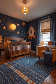 a baby's room decorated in blue and gold with stars on the wall, crib, rocking chair, and bed