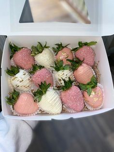 a box filled with lots of different types of strawberries