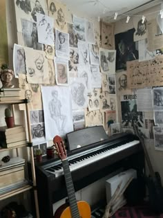 a room with a piano, guitar and many pictures on the wall behind it is cluttered with various items