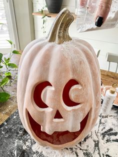 a carved pumpkin with the letter c on it