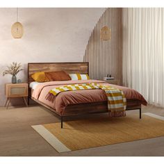 a bed room with a neatly made bed and a rug on the floor next to it