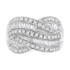 a white gold ring set with baguettes and round diamonds in the center, on a