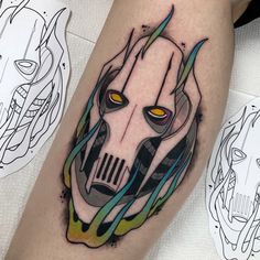 a tattoo on the leg of a person with a darth vader mask painted on it