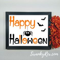 a happy halloween sign hanging on the wall