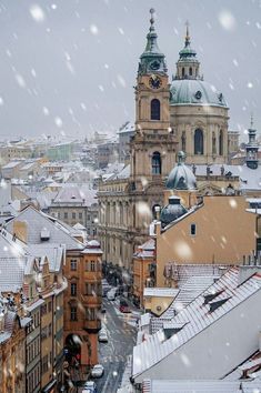 a snowy day in the city with snow falling