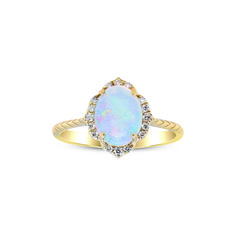 an opal and diamond ring on a white background