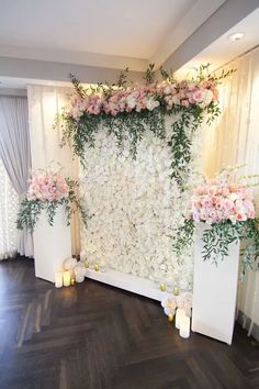 flowers and greenery decorate the backdrop for an event