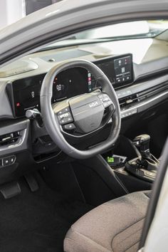 the interior of a car with dashboard and steering wheel