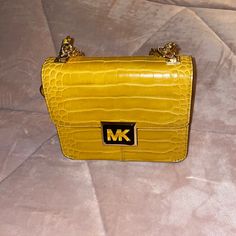 Nwot - This Is A Formed Michael Kors Croc Bag. It Has One Internal Zipper Pocket And One Back Pocket. The Chain Is Both Gold And Leather. It Has A Magnetic Snap Under The Mk Logo. Gold Bag With Branded Hardware For Errands, Gold Bags With Branded Hardware For Errands, Formal Yellow Shoulder Bag With Chain Strap, Tan Rectangular Bag With Chain Strap, Yellow Michael Kors Travel Bag, Yellow Leather Bag With Chain Strap, Michael Kors Yellow Leather Shoulder Bag, Michael Kors Bags With Gold-tone Hardware For Daily Use, Michael Kors Bags With Gold-tone Hardware