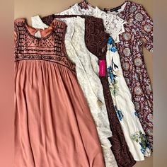 Small Lot Of Summer Dresses. Selling As The Group. Not So Mystery Bundle. 5 Dresses. Mixed Brands. All Size Small. Nwt Xhilaration Cream Floral Layered Sleeveless With Tassels Forever 21 Maroon Medallion Print Swing Dress Three Hearts Maroon Medallion Print 3/4 Sleeve Swing Japna Sleeveless Embroidered Mauve Rose Gauze (Small Blemish Noted While Photographing) Altar’d State Ivory Floral Lace Embroidered Neckline Summer Lightweight Springtime Spring Break Market Bazaar Wanderlust Easter Reseller Altar'd State Dress, Altar'd State Jewelry, Bohemian Cottage, Altar’d State Dress, Bohemian V-neck Mini Dress By Urban Outfitters, Medallion Print, Altard State Dresses, Three Hearts, Boho Mini Dress