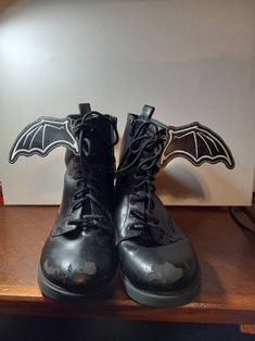 These super cool batwing charms were embroidered on marine vinyl. I added two grommet to each wing to keep it sturdy and make it easier to lace.  I also take custom orders. So if you would like different color vinyl and thread please message me when ordered.  These make great accessories for that perfect outfit for a gothic night on the town. Bat Wings For Converse, Shoelace Charms, Bat Wing, Costume Hats, Roller Skates, Bat Wings, Dr. Martens Boots, Spooky Halloween, Lace Boots