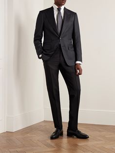 TOM FORD's signature 'Shelton' suit jacket has been meticulously tailored in Italy from a sharkskin wool-blend, the sophisticated fabric is characterised by its subtle two-tone weave. It has wide peak lapels and is fully lined in satin for smooth layering. The midnight-blue hue works for both daytime and evening events. Luxury Notch Lapel Suits For Business Meetings, Luxury Fitted Sport Coat For Business Meetings, Tailored Timeless Suit For Business Meetings, Tailored Suits For Business Meetings, Luxury Fitted Suit For Business Meetings, Luxury Tailored Suits For Business Meetings, Luxury Business Suits With Structured Boning, Luxury Suits With Suit Collar For Business Meetings, Tom Ford Mens Suits