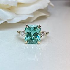 Radiant Cut Paraiba And Pear Moissanite Engagement Ring, 14k Gold Three Stone Wedding Ring, 3 Stone Tourmaline And Moissanite Ring #7156 #TourmalineRing #7156 #PearMoissaniteRing #PearAccents #WeddingRing #14kGoldThreeStone #3StoneRing #RadiantCutParaiba #MoissaniteRing #EngagementRing Three Stone Wedding Ring, Ring 3 Stone, Pear Moissanite Engagement Ring, Stone Wedding Ring, Pear Shaped Engagement Rings, Stone Wedding, Light Mint Green, 3 Stone Rings, Engagement Ring Shapes