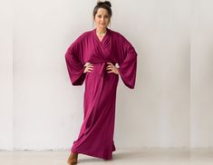 "Kimono maxi dress for women with long sleeves, belt and pockets in a beautiful magenta pink color. You will love this loose wrap dress in kimono style sewn by us from premium quality viscose fabric. Perfect everyday dress or with an elegant purse and shoes will be an evening dress or you can wear it as a robe! Loose long kimono dress or robe with characteristic, wide sleeves. A long belt at the waist that can be 'wrapped around' in a variety of ways, but also looks good with any leather belt. C Pink Kimono Dress, Long Kimono Dress, Loose Kimono, Robe Women, Kimono Maxi Dress, Pink Kimono, Mode Kimono, Maxi Kimono, Capsule Wardrobe Essentials