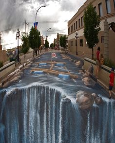 an image of a waterfall painted on the street