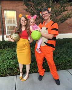 a man and woman are dressed up as winnie the pooh and tigger for halloween