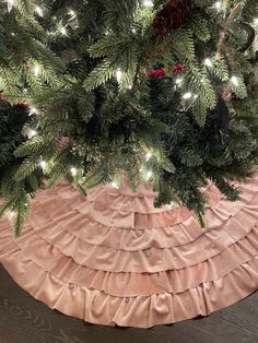 a christmas tree skirt with lights on it