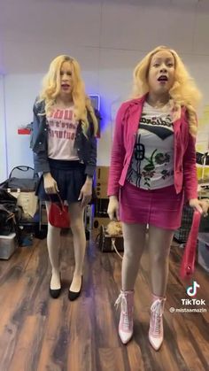 two female mannequins are standing in a room