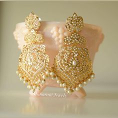 Ready to be shipped (Navratan option only) Pearl option will take a minimum of 3 weeks Beautiful 21k gold plated jadao earrings make a lovely statement for any bridal outfit or special occasion. Style: push-in Length: 3.5 inches Gold Plated Chandbali Bridal Earrings As Gift, Kundan Pearl Earrings With Stone Work For Festivals, Gold Plated Chandbali Bridal Earrings For Gift, Kundan Pearl Earrings With Stone Work For Celebrations, Elegant Kundan Pearl Earrings For Festive Occasions, Festive Pearl Drop Jhumkas For Reception, Gold Pearl Drop Bridal Earrings For Festive Occasions, Elegant Tilla Pearl Earrings For Wedding, Festive Gold Pearl Drop Bridal Earrings