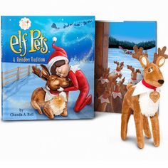 an elf is hugging a reindeer in front of a book