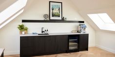 a kitchen area with an oven, sink and window in the corner on the wall