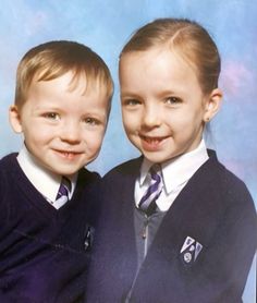 two young boys are posing for a photo