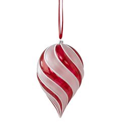 a red and white striped ornament hanging from a string on a white background